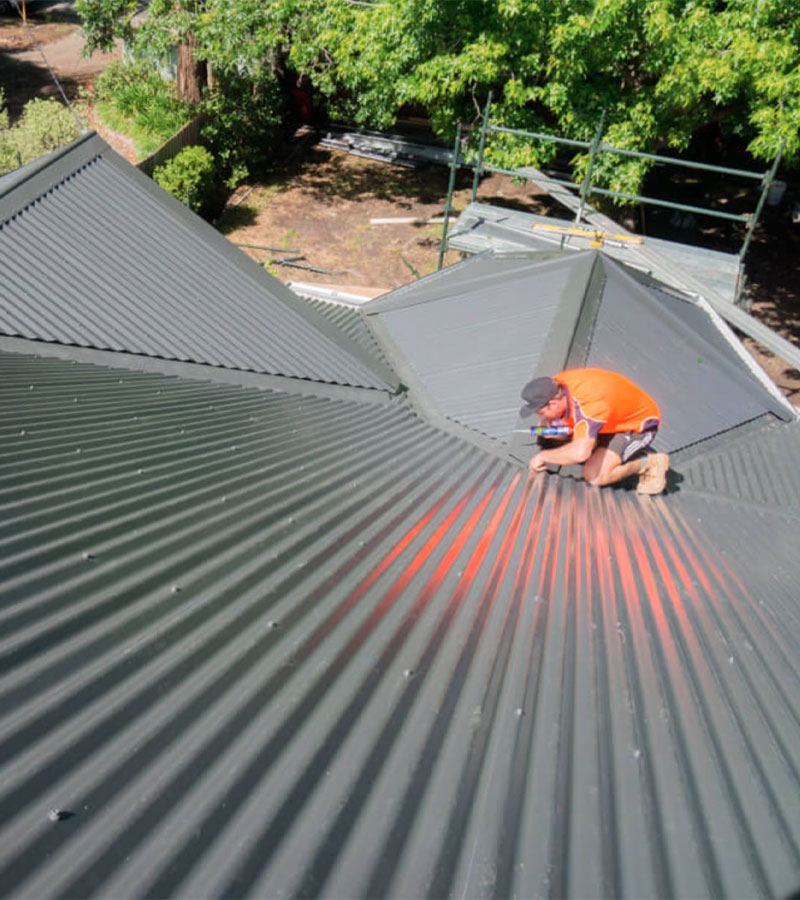 a colorbond roof being installed in Manoora by Cairns Roofing Services
